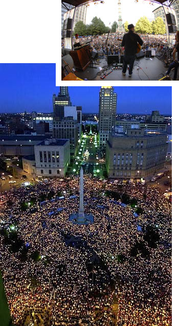 Large Crowd Gathering At Night In An Urban Square For An Event