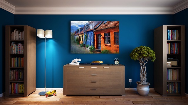 Interior Of A Cozy Room With Blue Walls, Furniture, And Decorative Painting