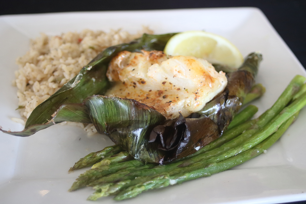 Banana Leaf Wrapped Sea Bass at Cosmos Restaurant in Orange Beach