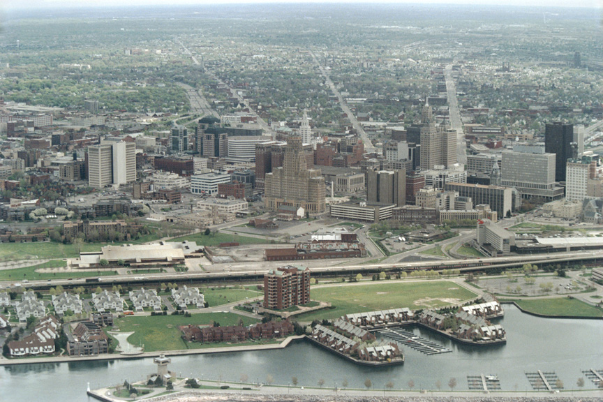 Aerial View Of A Cityscape With River And Buildings