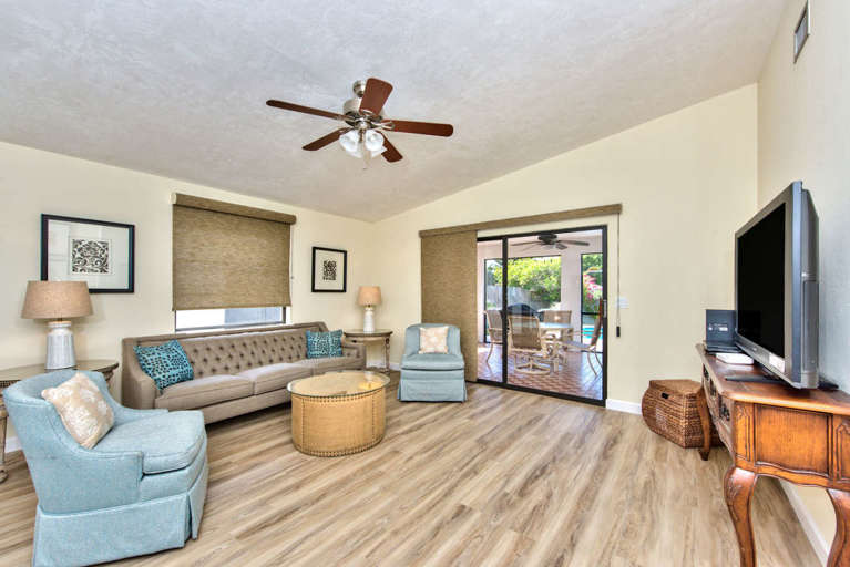 Living Room with Flat Screen HDTV and Fan; Private Entrance to Pool Area! Super Comfortable Couches to Relax in After a Day in the Sun!
