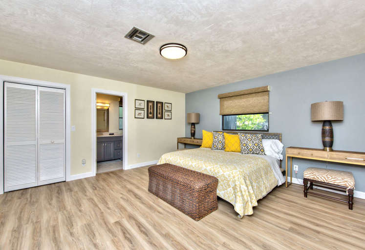 Master Bedroom with King Bed, Fan, and Flat Screen TV; Private Entrance to the Pool Area; Sheik Decor!