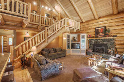 Beautifully Custom Crafted Log Home with 0pen plan living & wood burning fireplace.
