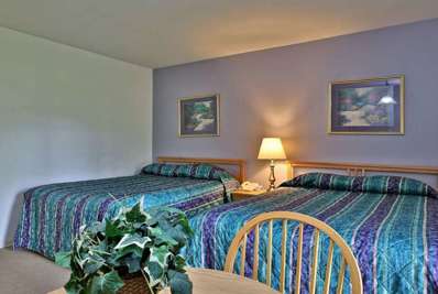 Get a good nights sleep in this bedroom with 2 double beds, flat screen TV and A/C.