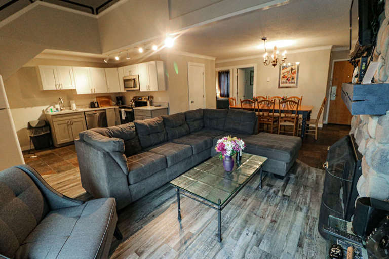 Open concept living/dining/kitchen space.  New flooring and a lot of seating. Turn up the fire and settle down for the relaxation you have been searching for.