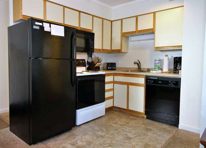 Fully equipped kitchen with gas stove and oven