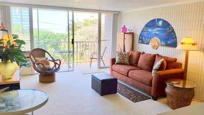 Living Room and Lanai (with table and chairs). Great for breakfast and sunsets!  Includes Sofabed, LCD TV, DVD, stereo, CD and wireless Internet.