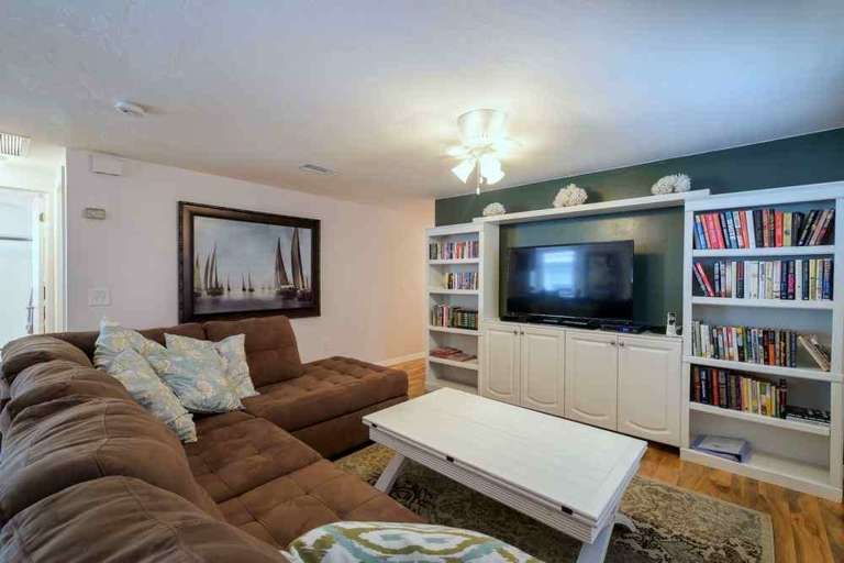 Spacious Living Room with Large Flat Screen TV