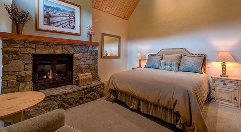 Master Bedroom has a Luxurious King Bed and Gas Fireplace