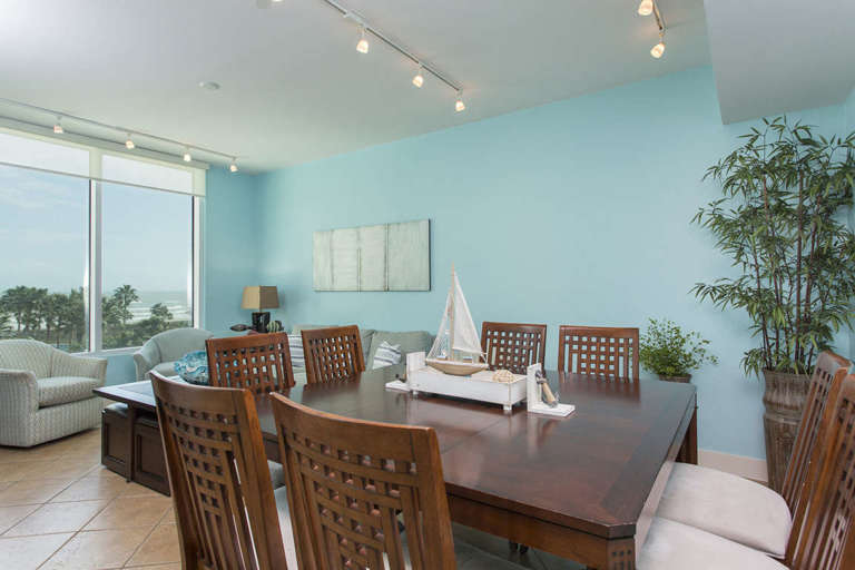 Open concept dining room accommodates 8 guests comfortably.