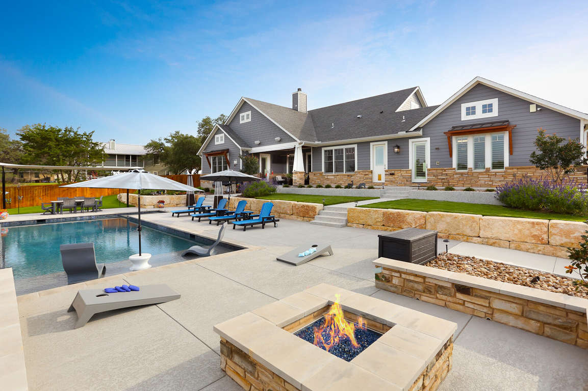 Backyard oasis with pool, spa,  and fire pit.