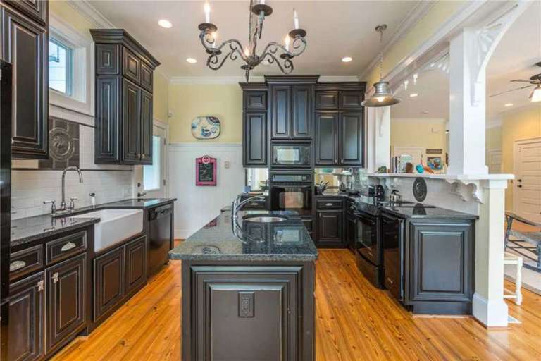 The Gourmet Kitchen Features Granite Counter Tops and a Double Oven