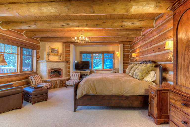 Master Bedroom with a King Bed, Fireplace, and HDTV