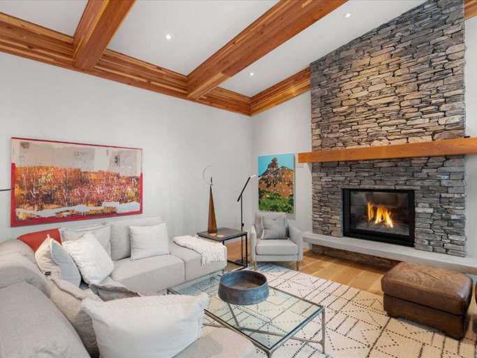 Living Room with Stone Fireplace and Modern Decor