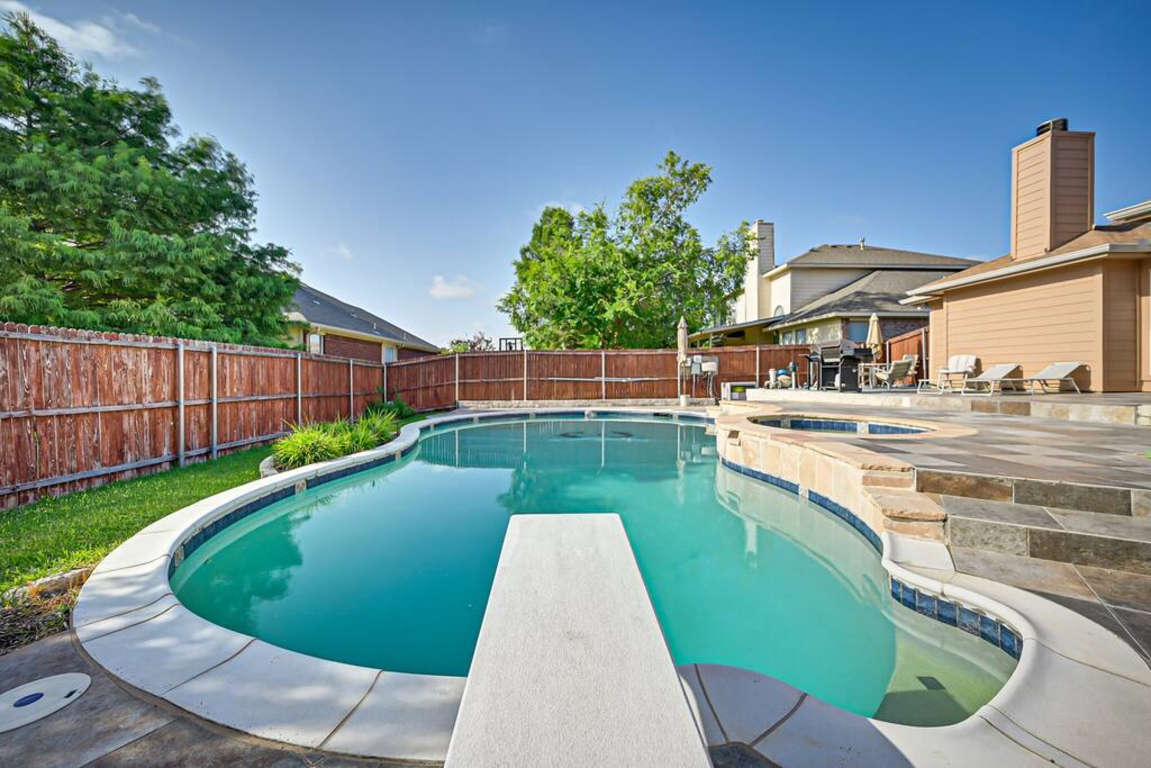 Full Diving Pool w/Diving Board, Hot Tub, Elevated deck, Tanning Area, and Grill Area in Backyard
