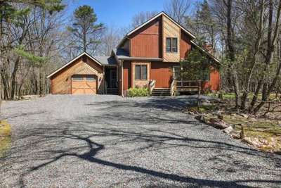 Navigate through the winding roads of Lake Harmony Estates until you come upon this beautiful home in the woods. Pull in and start your adventure!