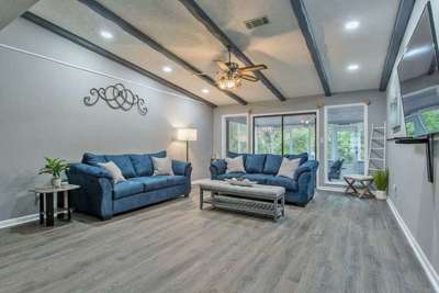 The second living room offers direct access to the enclosed patio.