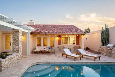 Fabulous courtyard home with a charming entry and amazing pool.