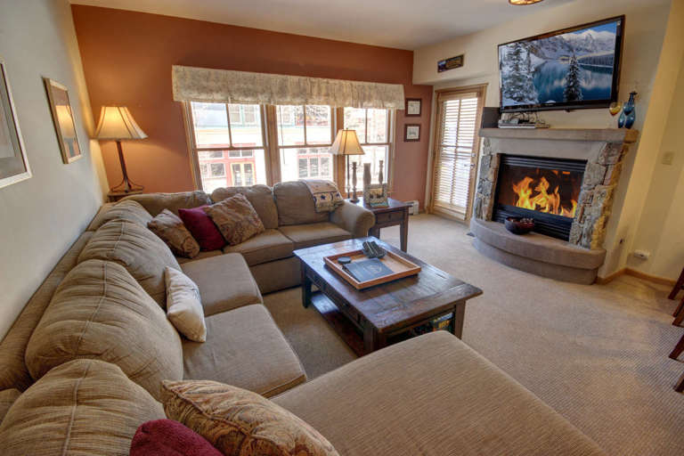 Living room with cozy fireplace and relaxing flat screen TV