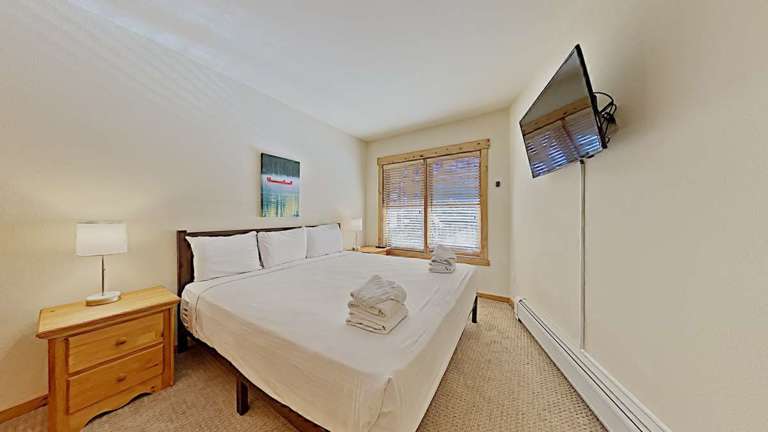 In the Master Bedroom, you will find a cozy bed with great views of the slopes and an ensuite bathroom.