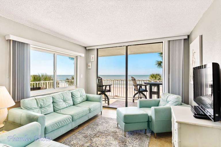 Living room with amazing direct Gulf front views