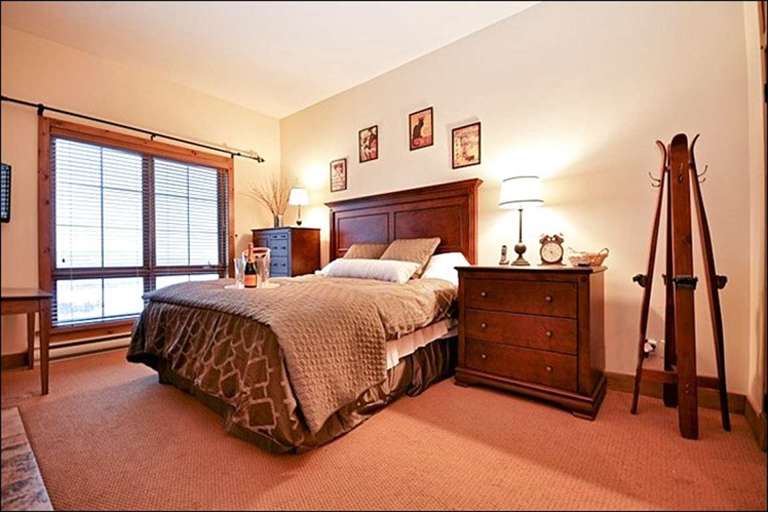 Master Bedroom has a Soft King Bed and Rustic Decor
